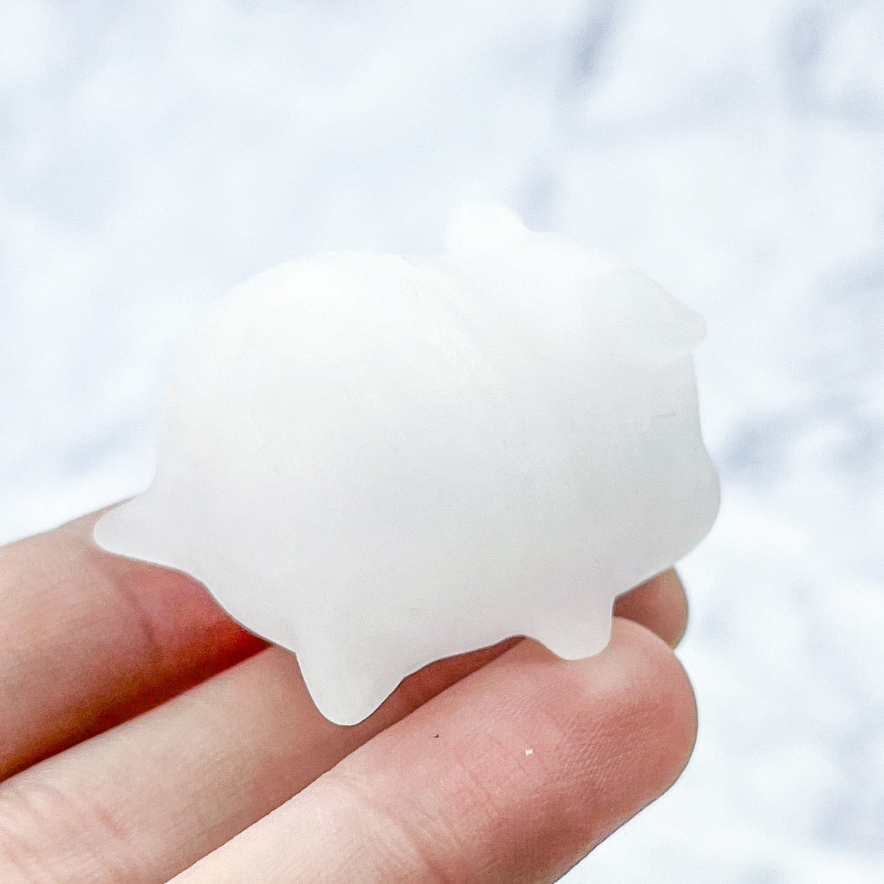 1.5 Inch Mangano Calcite Sleepy Piggy Carving