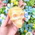 3.25 Inch Orange Calcite Skull E190