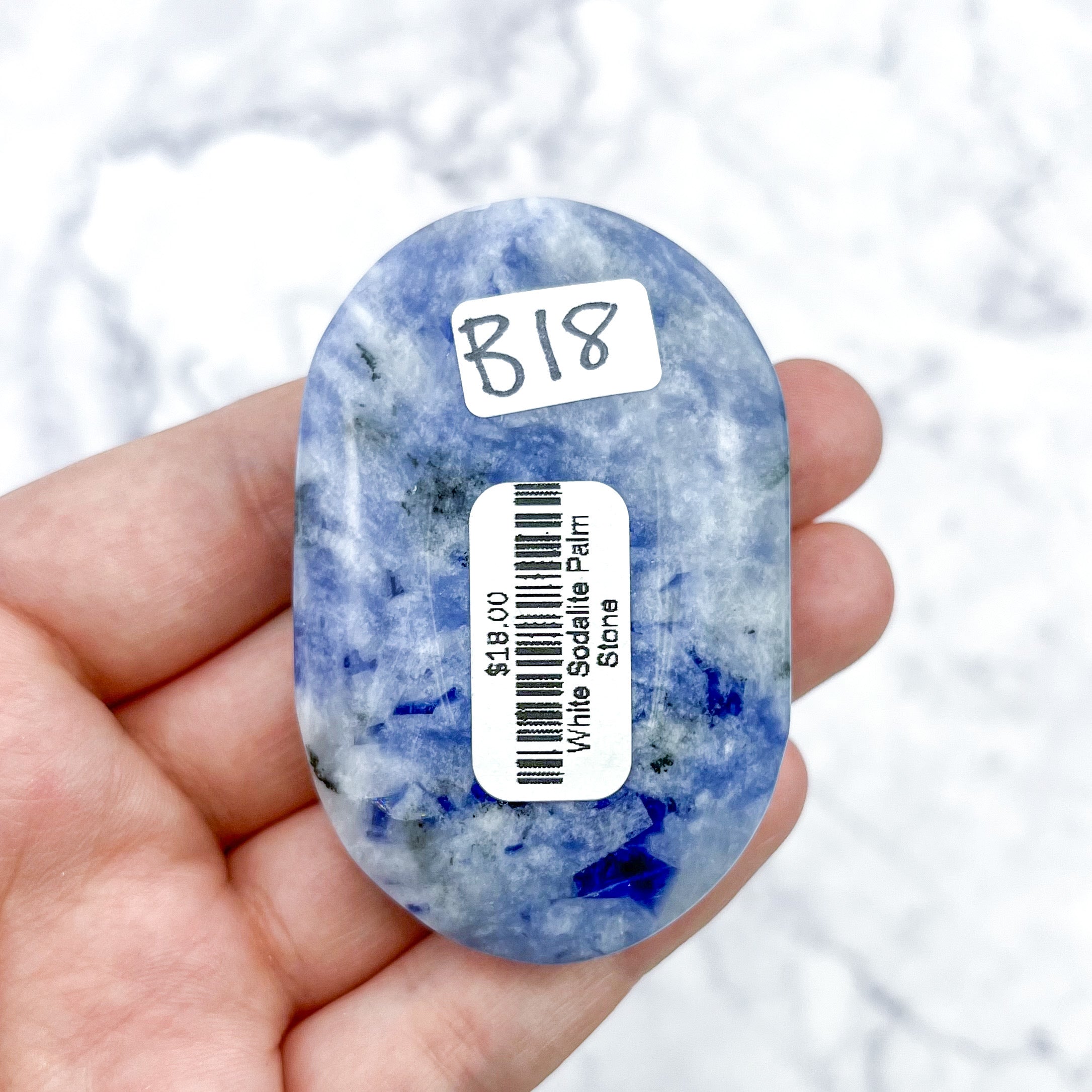 2.5 Inch White Sodalite Palmstone B18