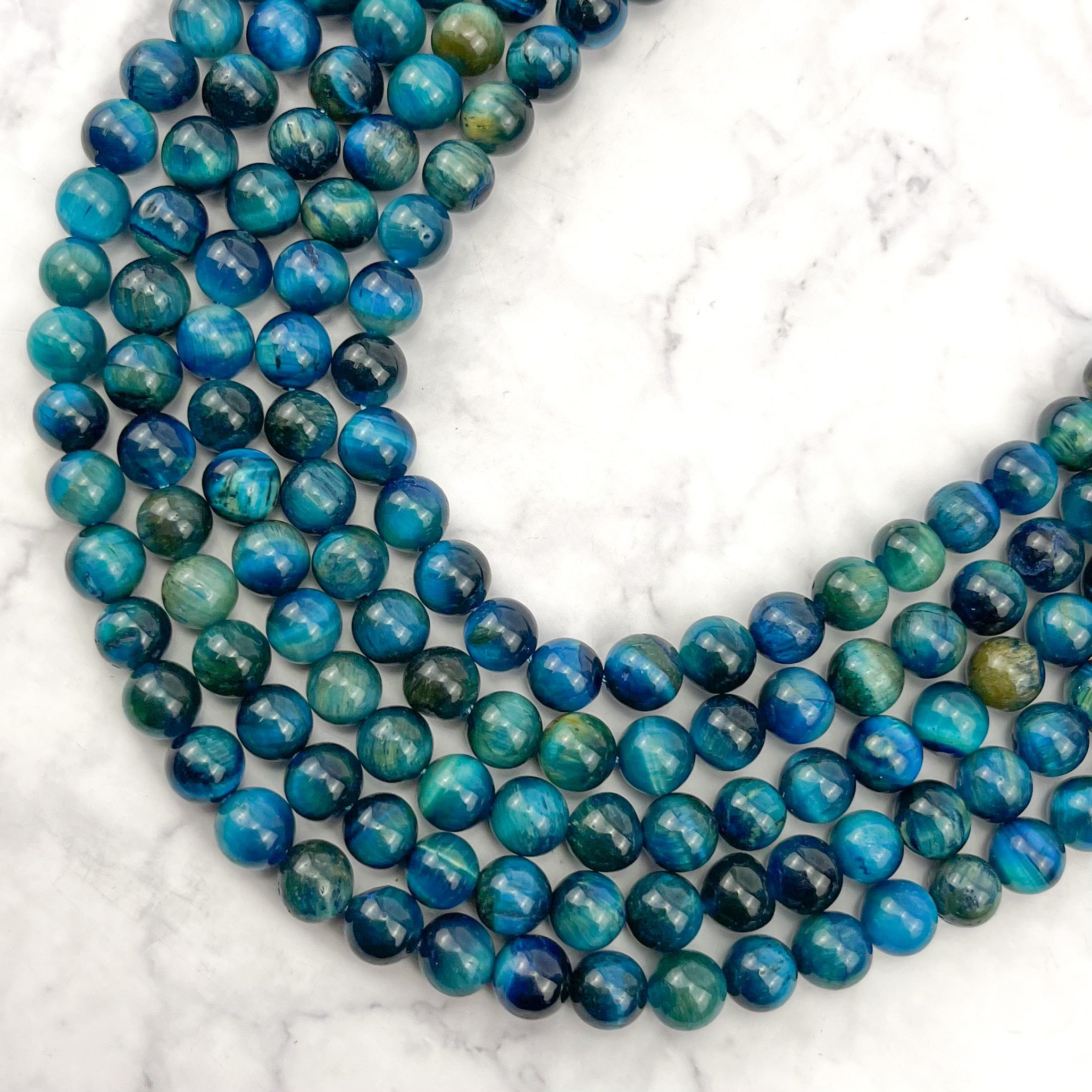 8mm Dyed Teal Tigers Eye Bead Strand