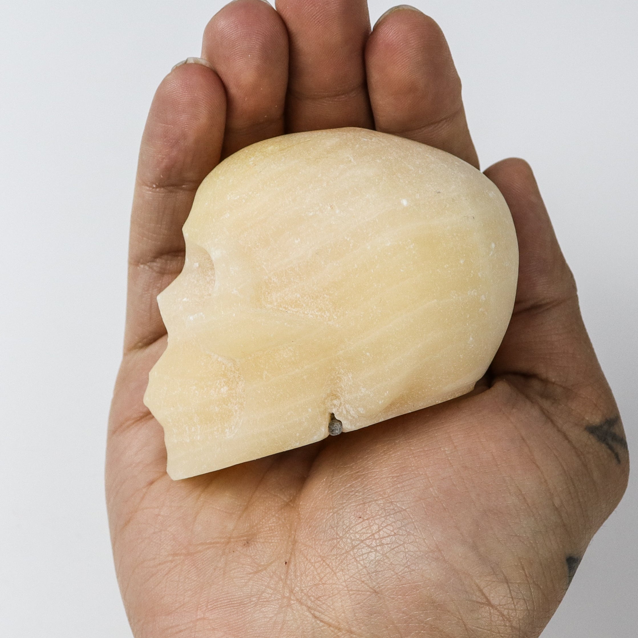 2.5 Inch Orange Calcite Skull $20