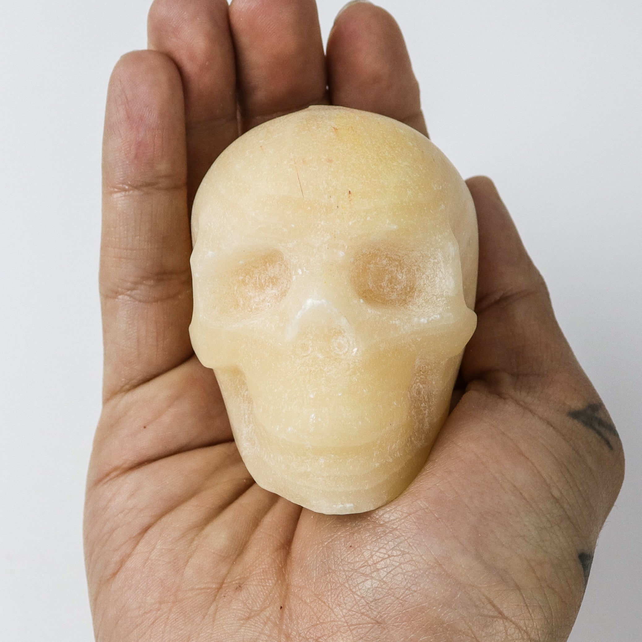 2.5 Inch Orange Calcite Skull $20