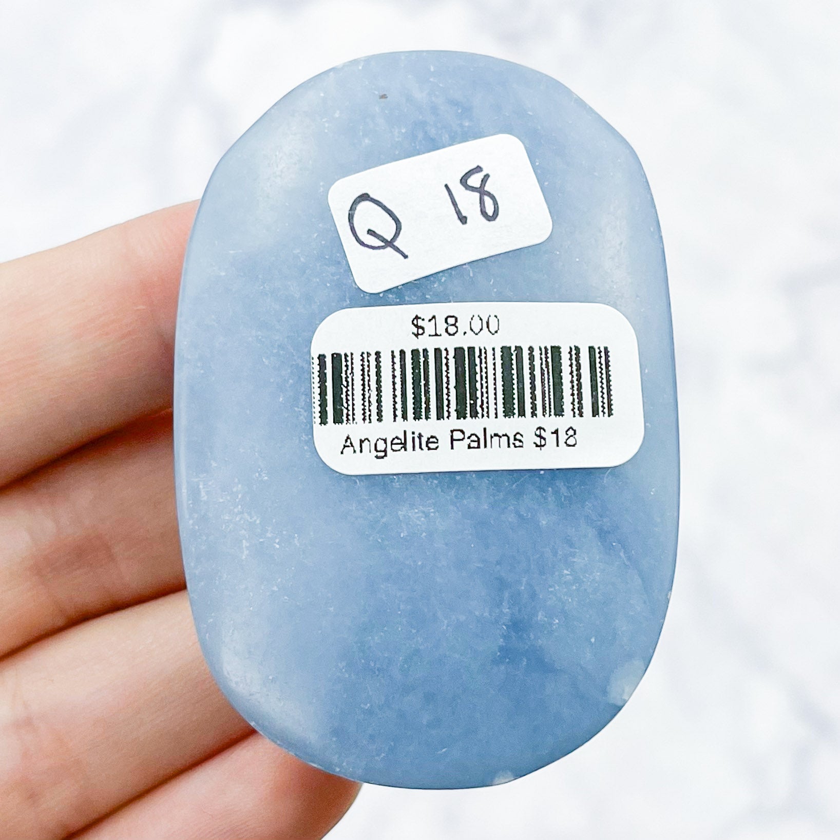 2.25 Inch Angelite Palmstone Q18
