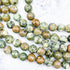 10mm Rhyolite / Rainforest Jasper Bead Strand H20