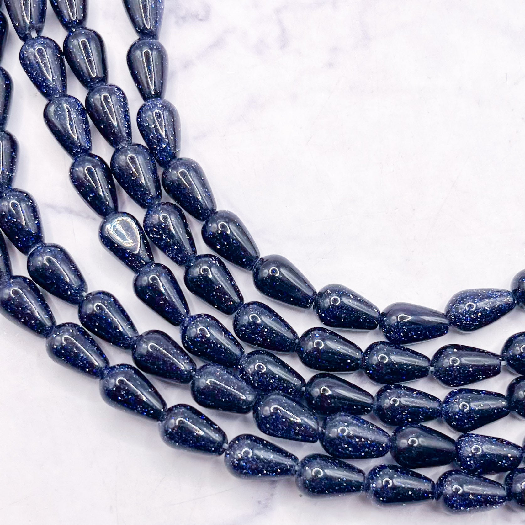 6x9mm Navy Goldstone Drop Bead Half Strand Q8