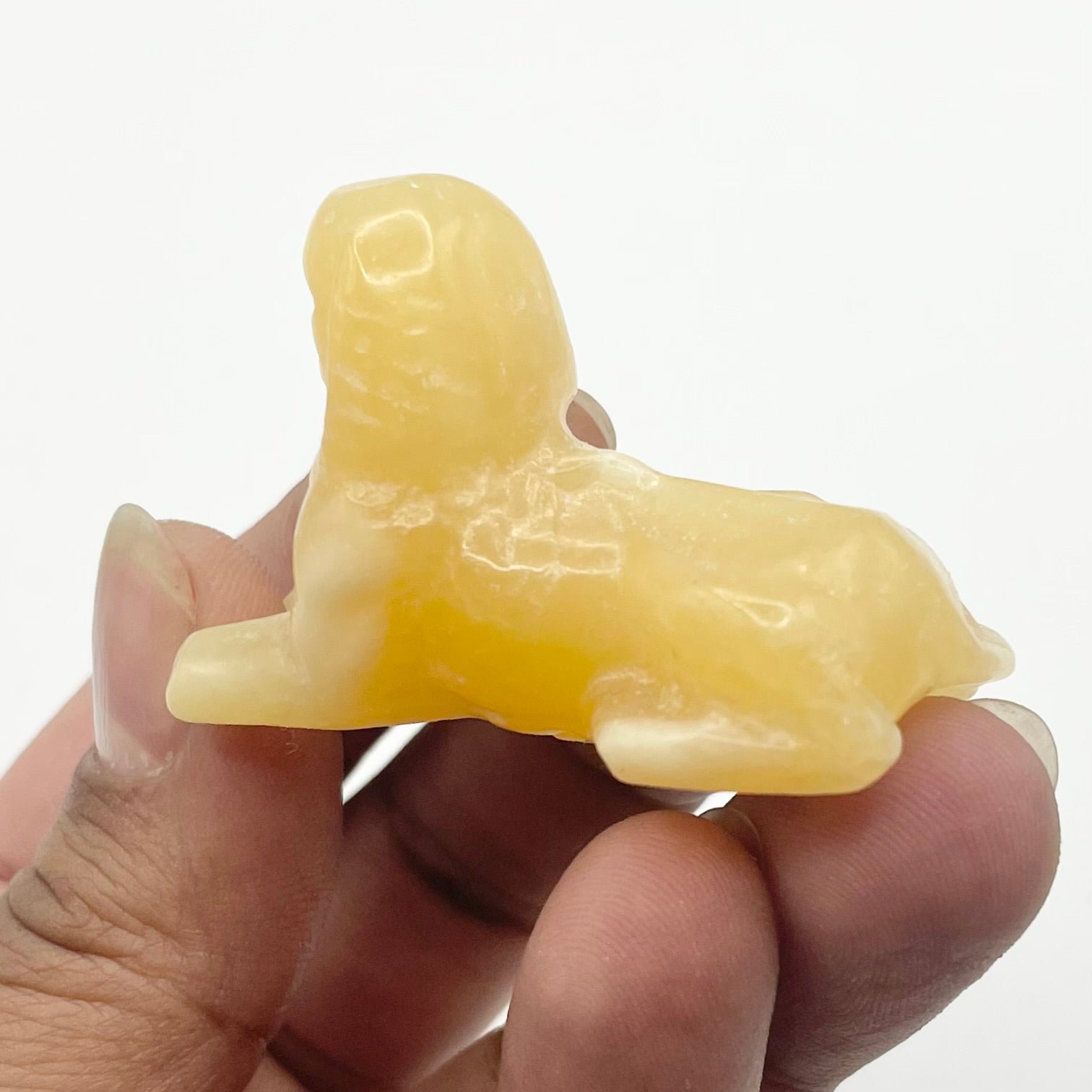 2 Inch Orange Calcite Sphynx Carving